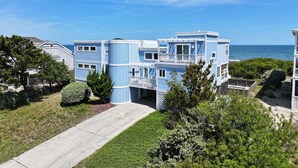 A multi-story building with a balcony and a view of the ocean. - OCEANFRONT, Private Pool, Ocean Views, Beach Walkway, Hot Tub, WL1035, PiraSea (Corolla)