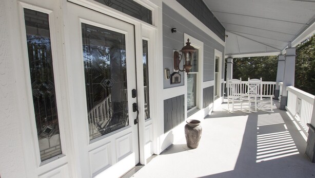 A covered porch with white railings, a large decorative urn, and a number plaque. - Soundside, Priv Pool, H Tub, ELEV, Rec Rm, Theatr Rm, FR1, The Drake (Duck)