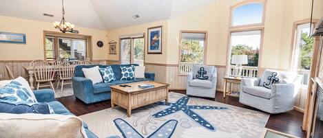 Télévision, cheminée, chaîne hi-fi