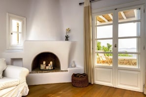 Villa, 4 Bedrooms | Living room | Flat-screen TV, fireplace - Villa Titania by The Pearls Collection (Mykonos)