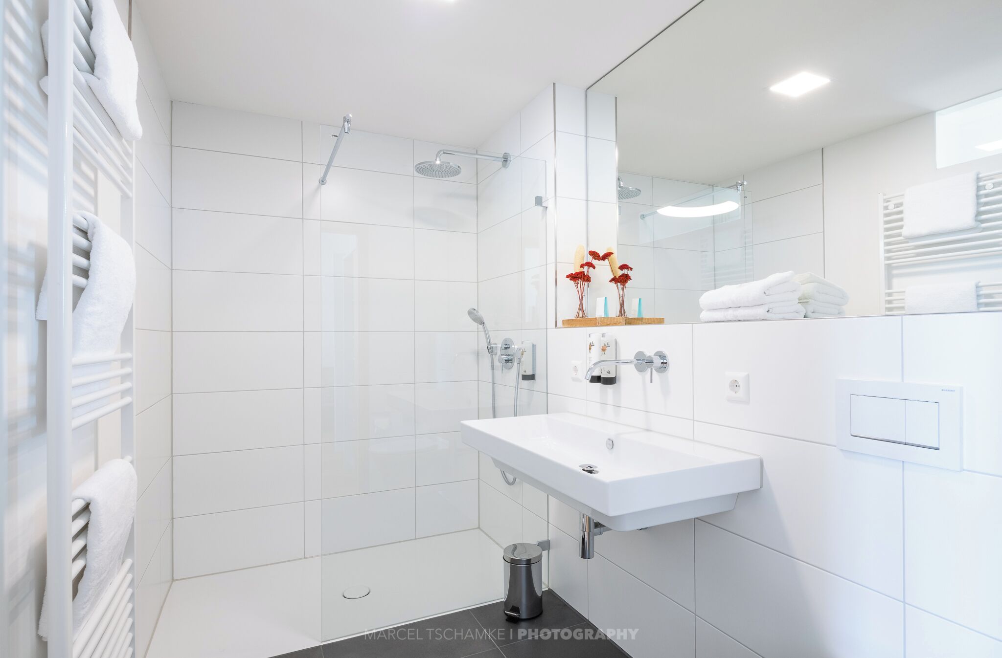 Shower, hair dryer, slippers, towels