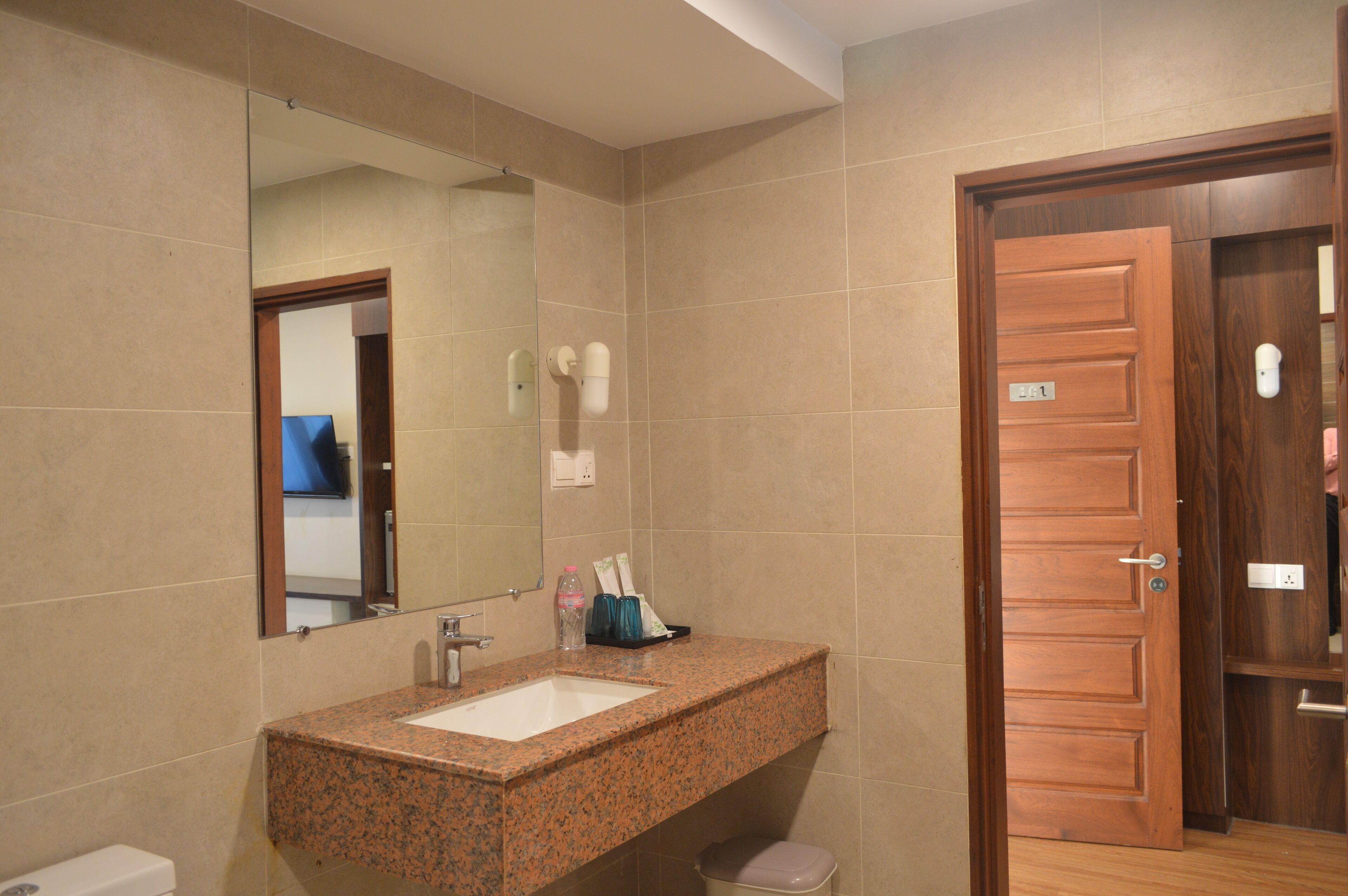 shower, slippers, towels, toilet paper