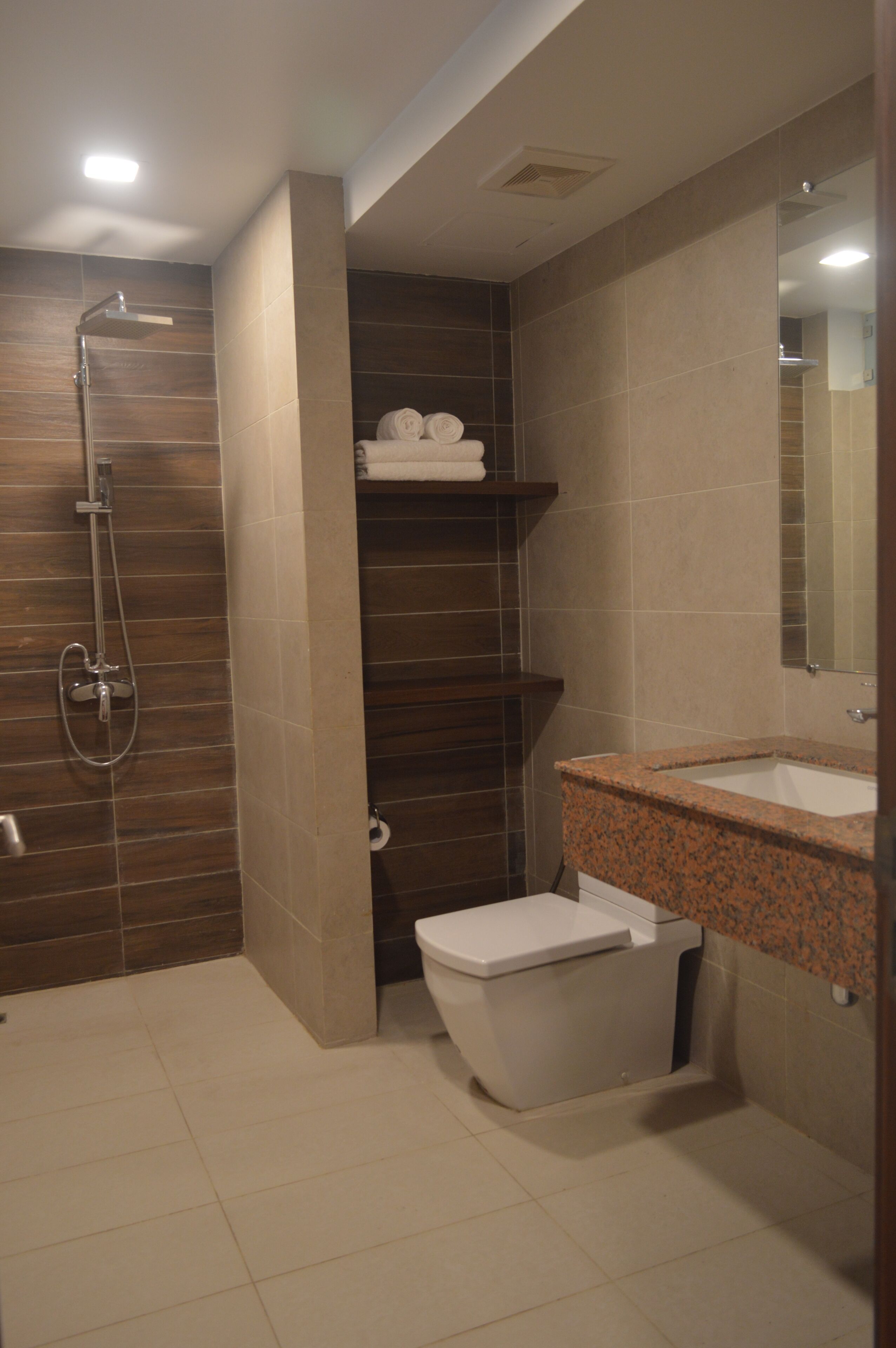 shower, slippers, towels, toilet paper