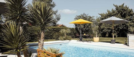 Seasonal outdoor pool, pool umbrellas, pool loungers