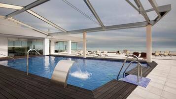 Seasonal outdoor pool, pool umbrellas, pool loungers