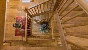 A wooden staircase with a railing, leading to a lower level. - The Homestead by Bloom Stays - sleeps 17 (Canterbury)