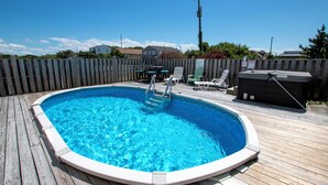 A wooden deck with a swimming pool, a hot tub, and outdoor furniture. - Oceanside, Private Pool, Close to Beach Access and Shopping! KH1, Marabel-by-the-Sea (Kitty Hawk)