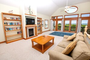 Flat-screen TV, books, stereo