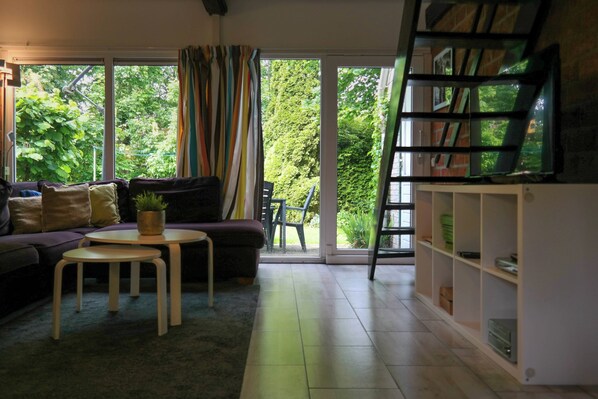 Bungalow, 3 Bedrooms, Terrace, Garden View | Living area | Books - Charming Bungalow in Oostmahorn, Netherlands - Perfect for Nature Lovers (Anjum)