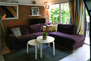 Bungalow, 3 Bedrooms, Terrace, Garden View | Living room | Books - Charming Bungalow in Oostmahorn, Netherlands - Perfect for Nature Lovers (Anjum)