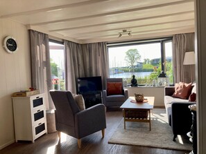 Bungalow, 2 Bedrooms, Patio, Garden View | Living area - Chalet Gaby With Sauna, Private Dock, and Canoes at Lauwersmeer (Anjum)