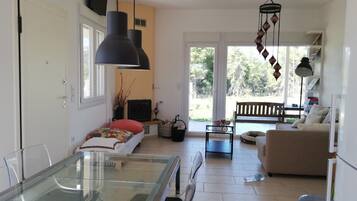 Villa | Living area | Flat-screen TV, fireplace