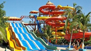A water park with multiple slides and water slides. - Orion Hotel (Tashkent)