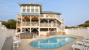 A two-story house with a swimming pool, deck chairs, and a covered hot tub. - Semi-Oceanfront, Private Pool, Poolside Bar, Hot Tub, Ocean Views! T1, Sailaway (Kitty Hawk)