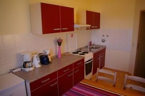 Apartment | Private kitchen | Fridge, stovetop, coffee/tea maker