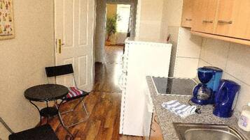 Apartment | Private kitchen | Fridge, stovetop, coffee/tea maker