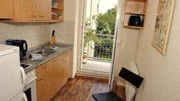 Apartment | Private kitchen | Fridge, stovetop, coffee/tea maker