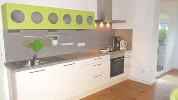 Apartment | Private kitchen | Fridge, microwave, stovetop, dishwasher