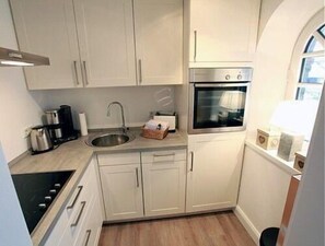 Apartment (Strandjuwel im Oceanhouse) | Eigene Küche | Kühlschrank, Wasserkocher, Hochstuhl, Kochgeschirr/Geschirr/Besteck