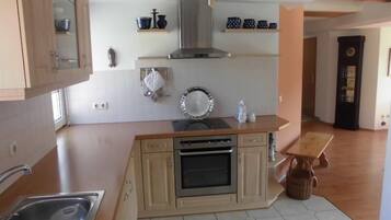 Apartment | Private kitchen | Fridge, stovetop, dishwasher, coffee/tea maker