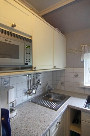 Apartemen | Dapur pribadi | Lemari es, microwave, kompor, dan mesin pencuci piring