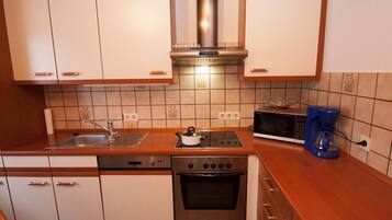 Apartemen | Dapur pribadi | Lemari es, microwave, kompor, dan mesin pencuci piring