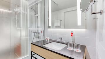 Shower, rainfall showerhead, hair dryer, towels