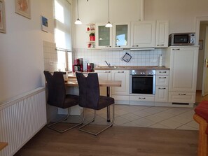 Apartment | Private kitchen | Fridge, microwave, stovetop, dishwasher