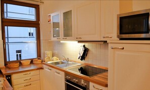 Apartment | Private kitchen | Fridge, microwave, stovetop, dishwasher