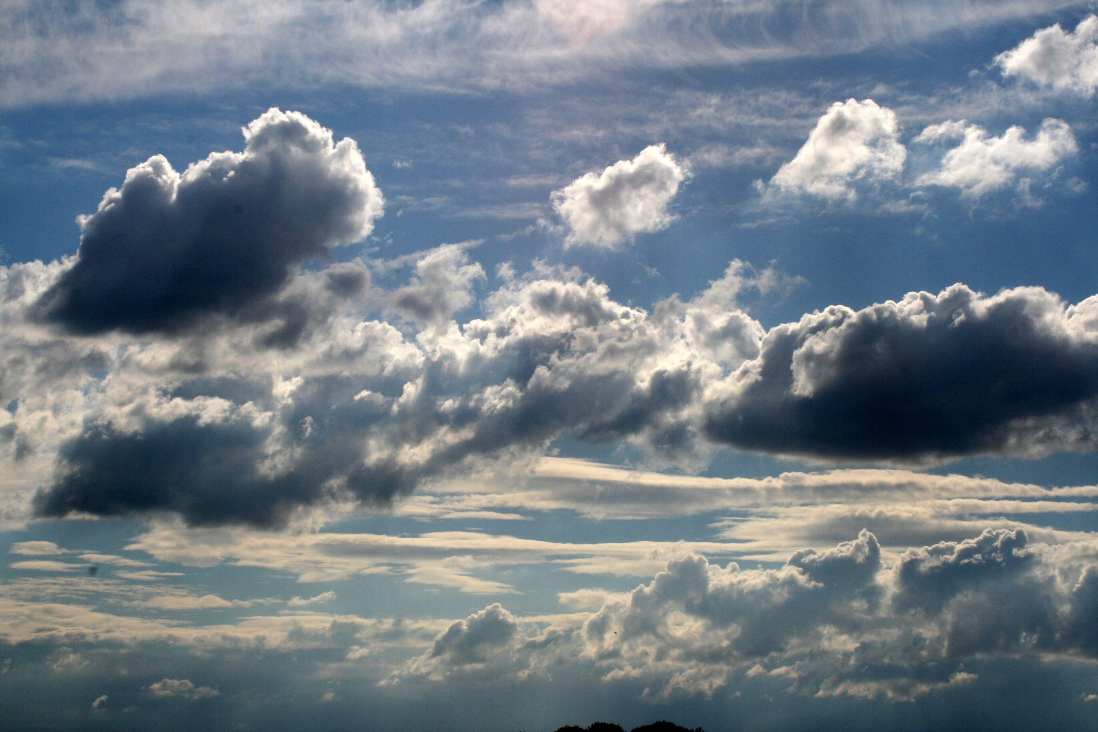 A view of the sky with various cloud formations.