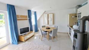 Appartement | Salle de séjour | Téléviseur, foyer
