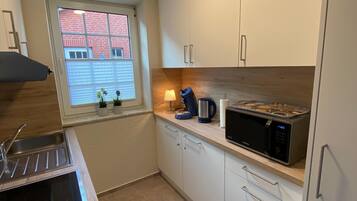 Apartment (Ferienwohnung Am Südstrand) | Private kitchen