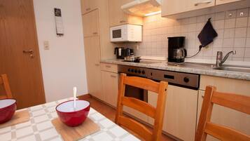 Apartment | Private kitchen | Fridge, microwave, stovetop, dishwasher