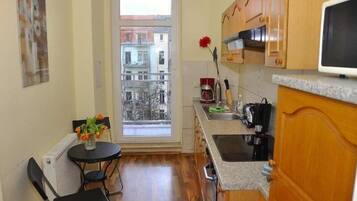 Apartment | Private kitchen | Fridge, stovetop, coffee/tea maker
