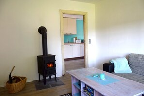 Appartement | Salle de séjour | Téléviseur, foyer