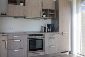 Ferienhaus | Eigene Küche | Kühlschrank, Mikrowelle, Herdplatte, Geschirrspüler