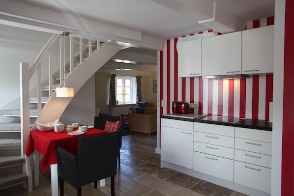 Fridge, stovetop, dishwasher, coffee/tea maker