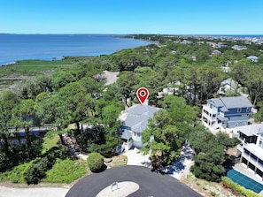 A residential area with a large house featuring a two-story structure, a swimming pool, and a view of the ocean. - Soundfront, Sound views, Private Pool, Hot Tub, MS12, Sounds Amazing (Corolla)