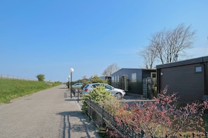 Bungalow, 2 Bedrooms, Patio, Garden View | Property grounds - 4pers - House w Sauna, Winter Garden & Fishing Pier in Front of the Lauwersmeer (Anjum)