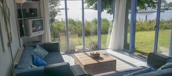 8 Pers Chalet Carla in Front of the Lauwersmeer and own Fishing Pier