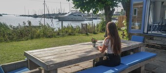 8 Pers Chalet Carla in Front of the Lauwersmeer and own Fishing Pier