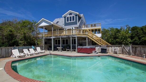A two-story house with a pool, a covered patio, and a barbecue area. - Oceanside, Private Pool, Screened Porch, Hot Tub! WW910, Serenity on the Beach (Corolla)