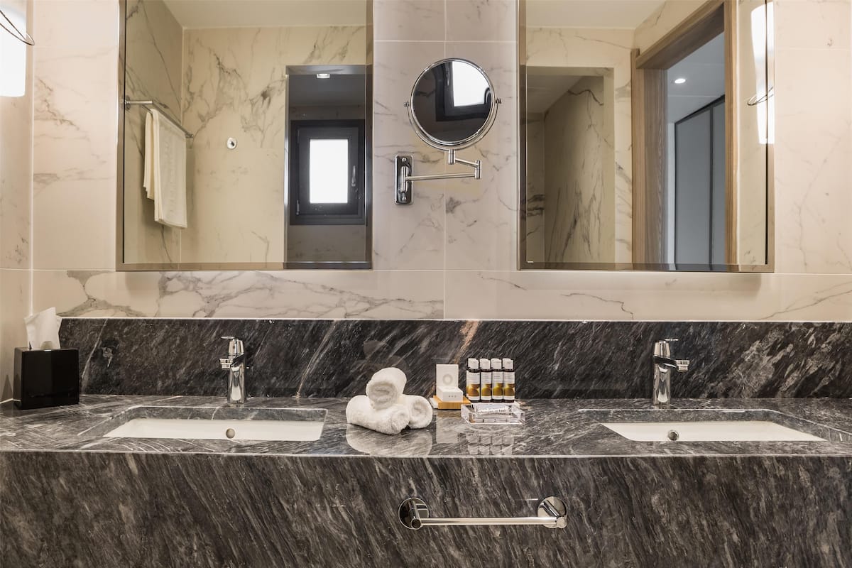 executive suite, private pool | bathroom | eco-friendly toiletries, hair dryer, bathrobes, slippers