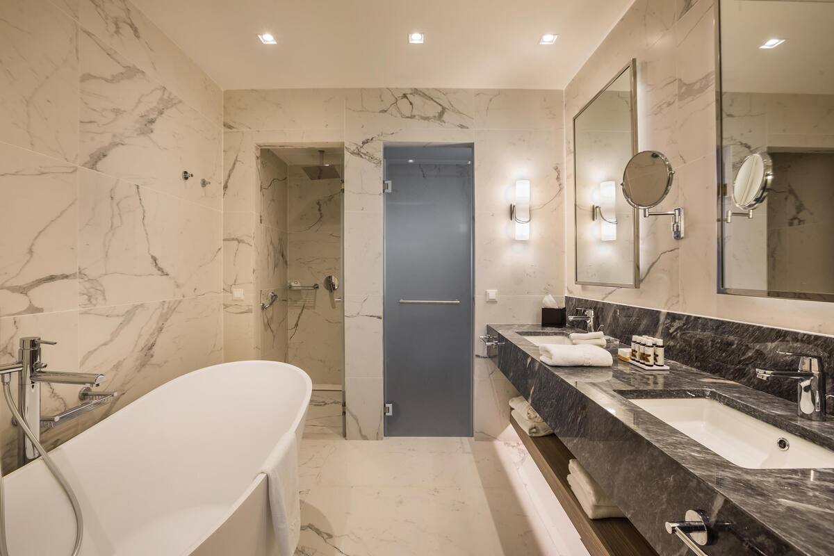 premium suite (two storey) | bathroom | eco-friendly toiletries, hair dryer, bathrobes, slippers