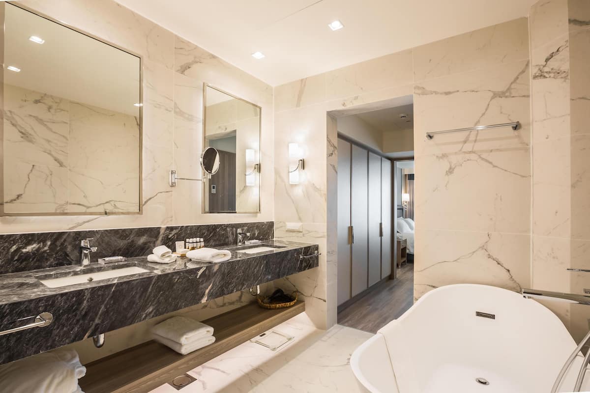 premium suite (two storey) | bathroom | eco-friendly toiletries, hair dryer, bathrobes, slippers