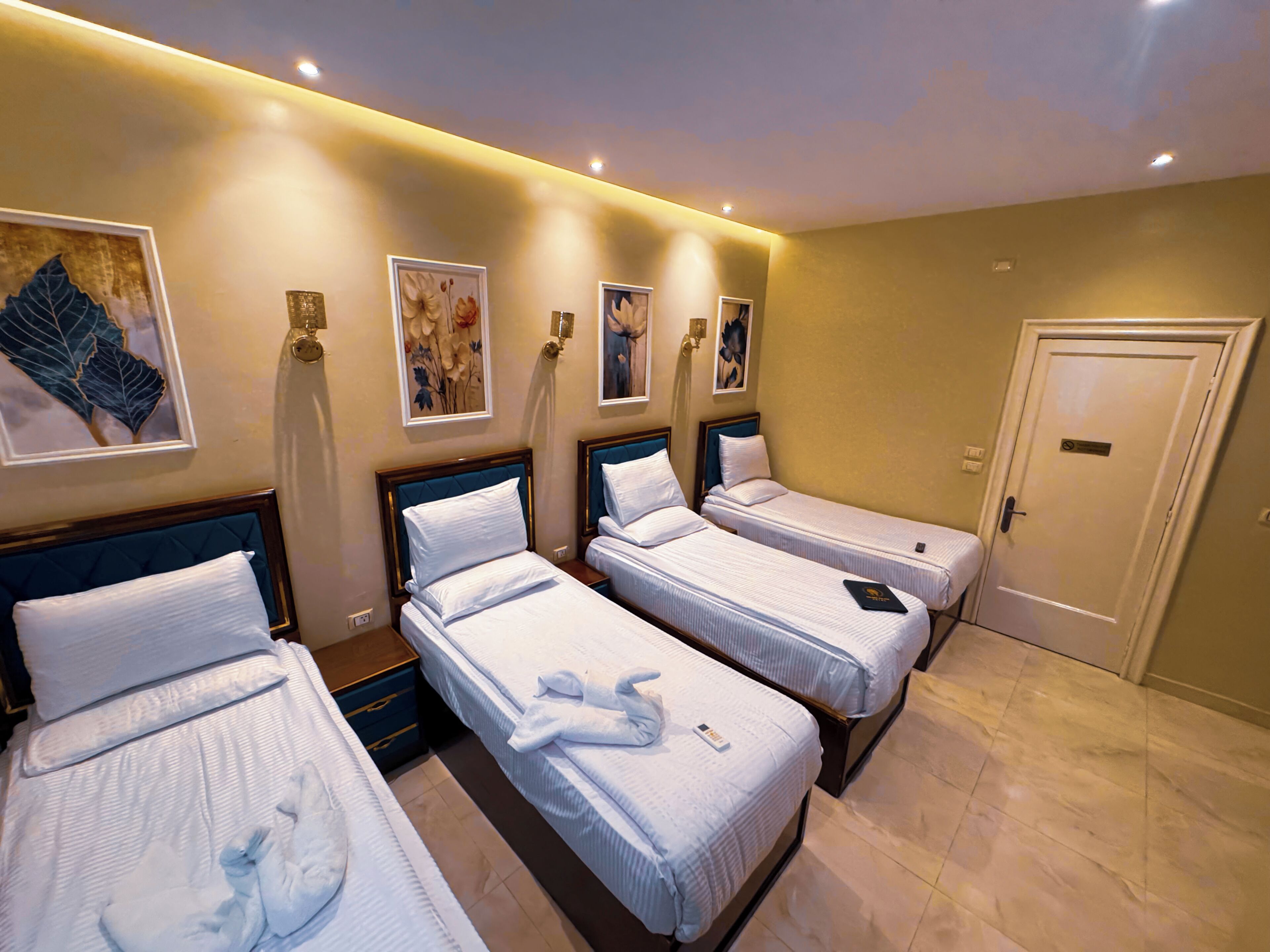 Comfort Quadruple Room, City View | Premium bedding, down comforters, memory foam beds, minibar