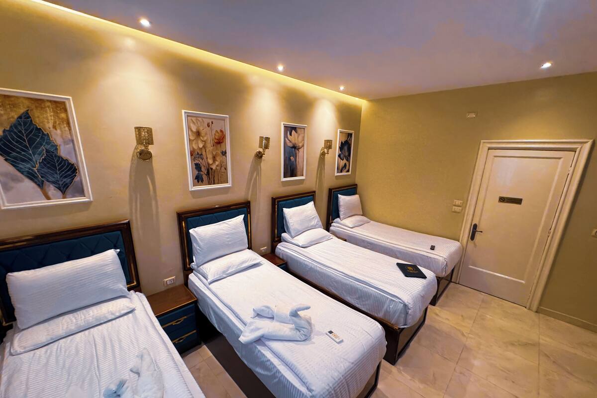 Comfort Quadruple Room, City View | Premium bedding, down comforters, memory foam beds, minibar