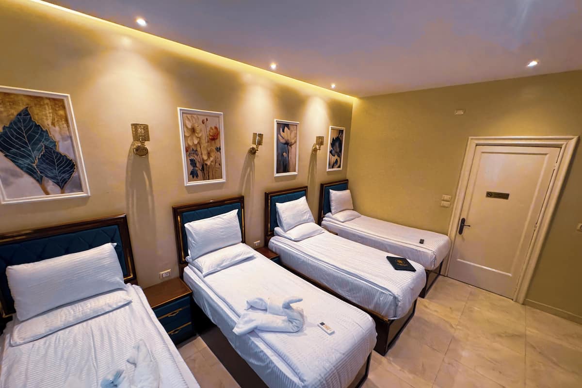 Comfort Quadruple Room, City View | Premium bedding, down comforters, memory foam beds, minibar