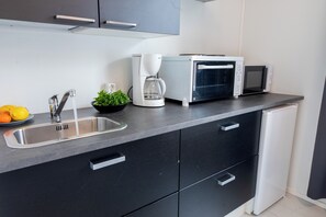 Family Room, Private Bathroom | Private kitchen | Shared fridge, microwave, coffee/tea maker, electric kettle - Vanha Postitalo (Varkaus)