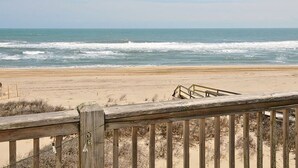 A beach with a wooden boardwalk leading to the shore. - Starlights Condos, OCEANFRONT, Extraordinary View, Together Yet Private! (Buxton)